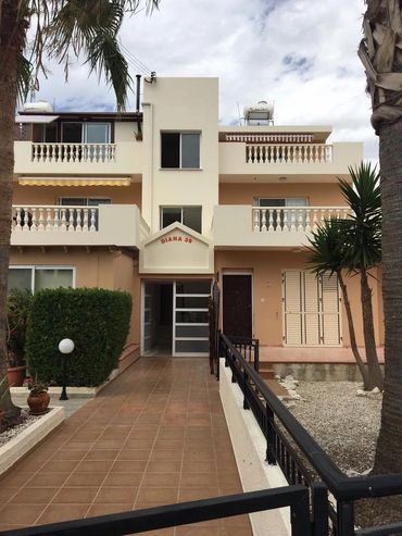 Complex in Universal, Paphos. Painted in Magnolia and Architectural Peach.