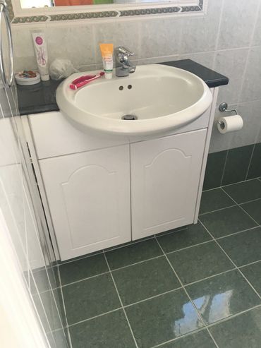 Interior Bathroom Cabinet Painted in Kissonerga with Benjamin Moore Paint.