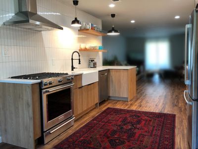 IKEA Cabinets with wood doors from Semihandmade doors were used in this Austin Kitchen Remodel