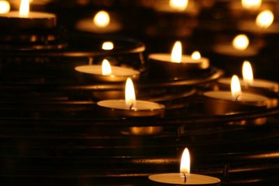 Night time view of offertory candles in a church