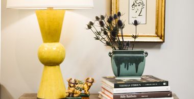Modern yellow table lamp by Currey & Co. with accessories and art, The Design Gallery showroom