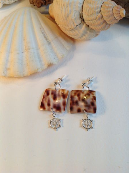 COWRIE SHELL AND 'SHIP'S WHEEL' DROP EARRINGS.