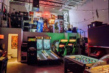 Skee ball, bubble hockey, arcade, pinball games and artwork.