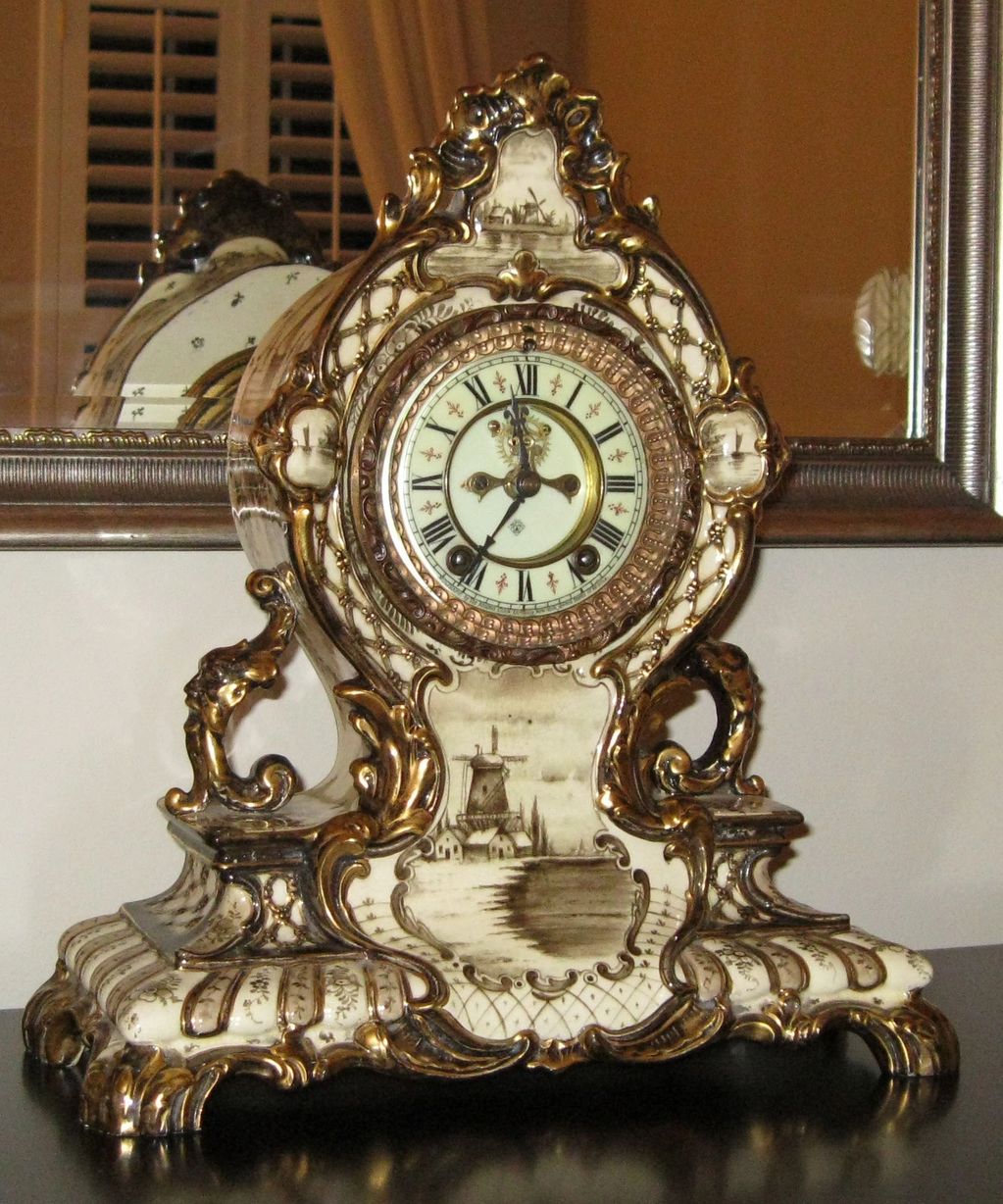 Circa 1904 "La Cerda" Royal Bonn porcelain clock in a very rare brown Delft finish.