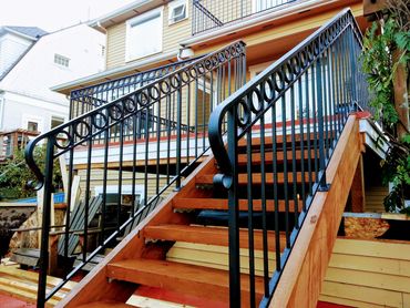 Exterior guard and hand railing for deck patio with hand forged lambs tongue terminations 