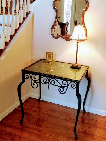 Hand forged iron accent table interior