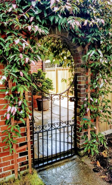 Garden gate with lock box and C-scrolls