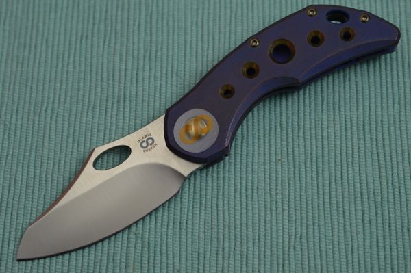 Olamic Cutlery BUSKER, Semper M390 Blade, Titanium Kinetic Ocean Frame (SOLD)