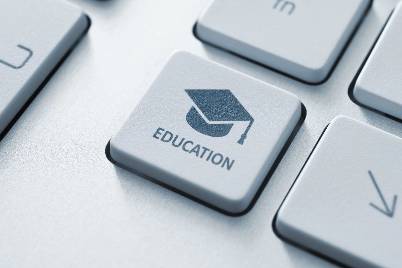 Keyboard key labeled 'Education' with graduation cap icon.