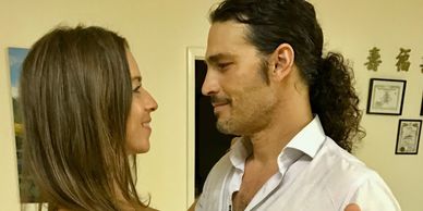 Looking at each other with love-couple takes their first ballroom dance lesson with Ganine-long hair