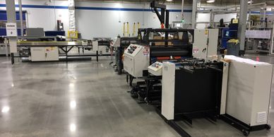 High Speed VDF Feeder Paired with a Two Sided High Speed Thermal Film Laminating System
