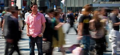 A picture of a man standing out from the crowd