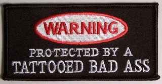 WARNING PROTECTED BY A TATTOOED BAD ASS