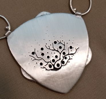 Pierced back of custom commissioned pendant  for an Ocean Jasper gemstone.