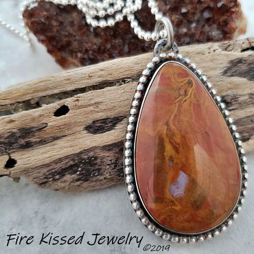 Stunning designer grade Flame Agate cabochon,  fine and sterling silvers with bead framing.