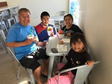 family enjoying shave ice 