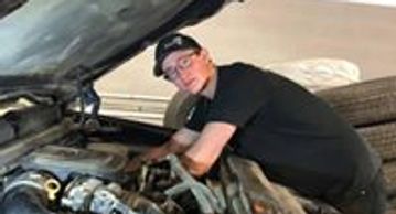 First-year journeyman apprentice Cole Rheume is under the hood providing Saskatoon car servicing.