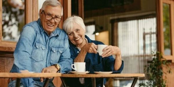 Two Medicare Beneficiaries Enjoying Their Morning Coffee