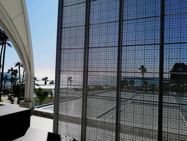 Patterned aluminium panel and shade sail at parklane Limassol by Shadeprts Plus Cyprus.