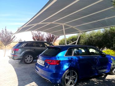 a carport providing car shade for two cars by Shadeports Plus Cyprus.