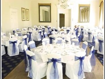 white chair covers with sash