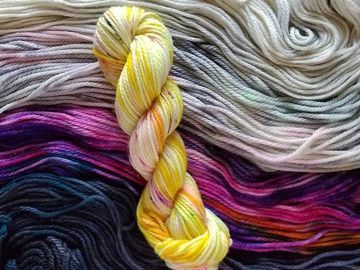Sultan chunky yarn laid out with a skeined Usagi sitting on top.