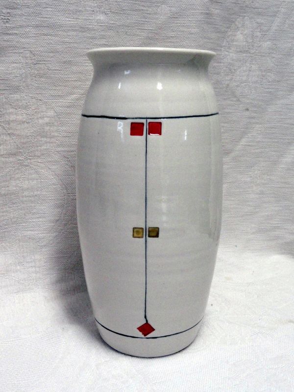 Porcelain vase with prairie design. Tall and scuplted with fine line detail. Embossed with color.