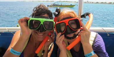 Women on a snorkeling trip wearing goggles