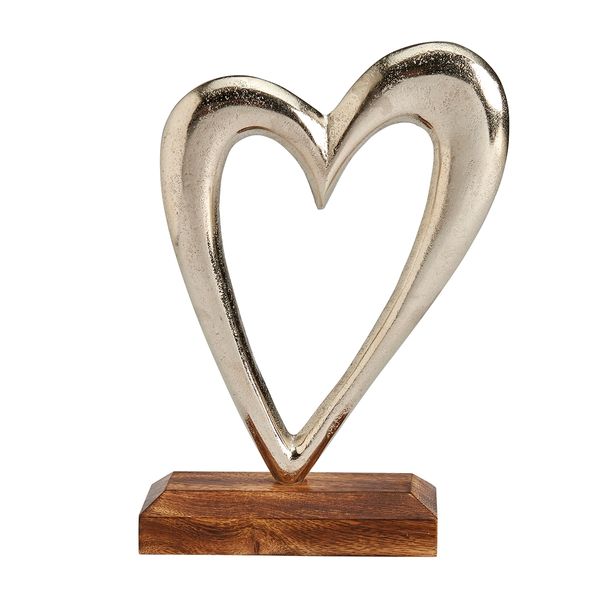 Large silver metal heart on wooden base