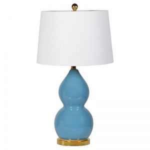 Blue lamp with gold metal base and top with linen shade