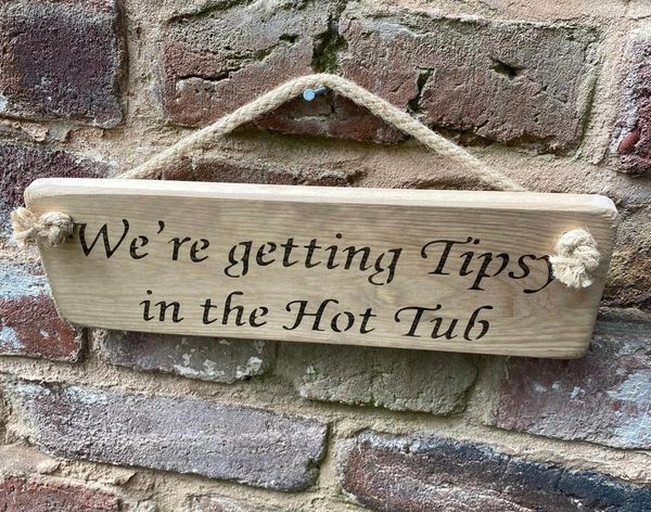 We're getting Tipsy in the hot tub Sign