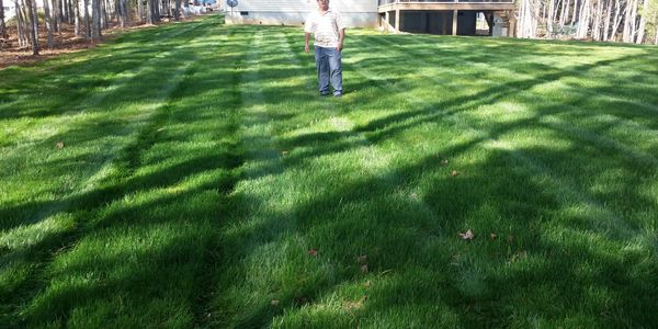 Lawn fertilization, aeration and seeding