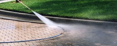 Pressure washing residential driveway