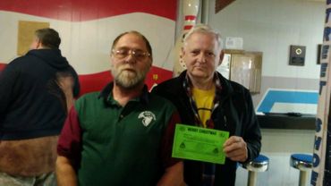 Gary Critchfield Presenting the Christmas Dinner Certificate to a fellow Vet.