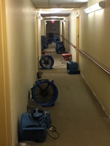 drying equipment for water damage restoration at a commercial facility