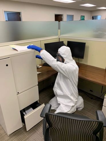 Technician cleaning touch points and disinfecting for Covid19 Coronavirus Pandemic