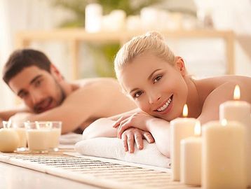 A happy couple ready to receive a couples massage