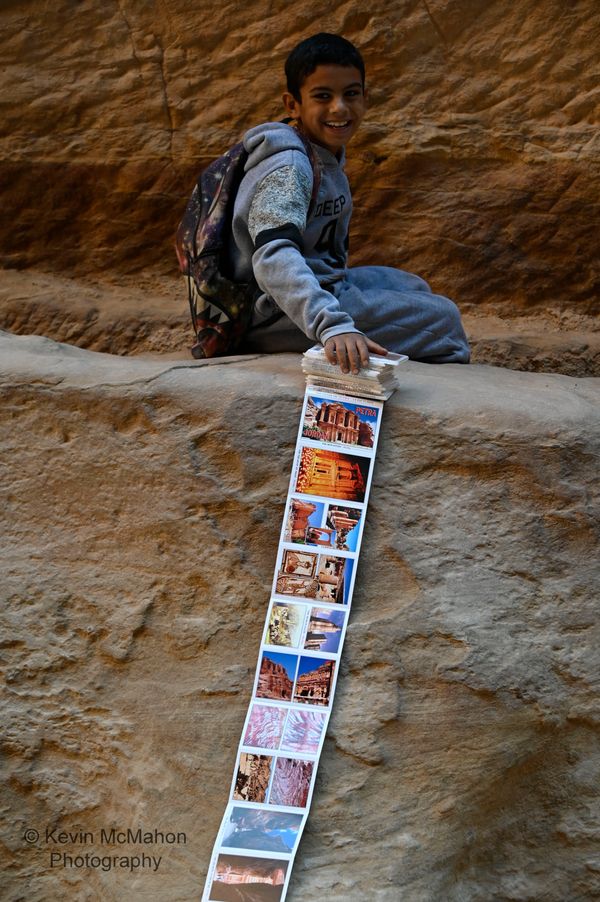Jordan, Petra, Al Siq, boy selling postcards