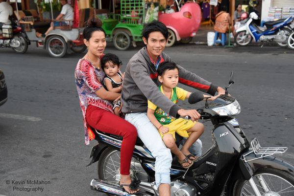 Cambodia, Phnom Penh, family on motorcycle