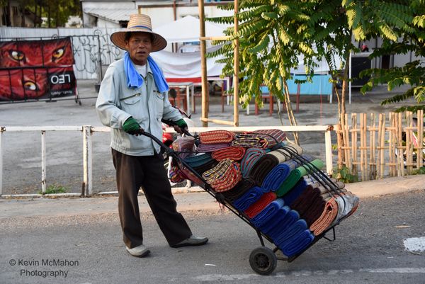 Thailand, Chang Mai, man with rug cart