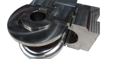 This image of tools for bending is  a bend die with a clamp insert and a clamp die insert.