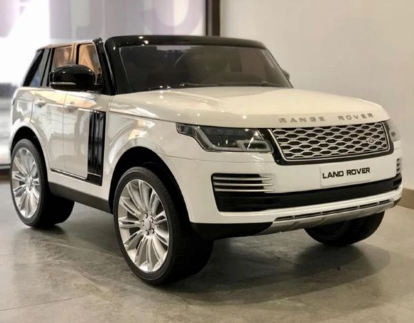 (white Range Rover )TOUCH TV , 24V , GIANT LICENSED LAND ROVER / RANGE ROVER ,AGES 2-7 PARENTAL REMOTE CONTROL OR PRESS ON PEDAL AND GO.. LEATHER SEAT , RUBBER TIRES , 4WD .