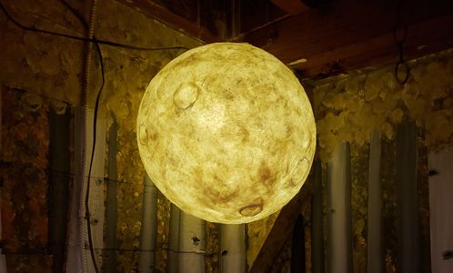 glowing moon in the Outlands enchanted forest through a wardrobe