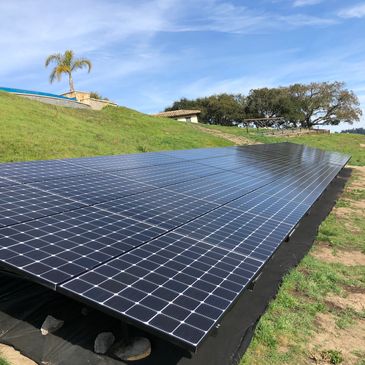 Home hillside solar panel installation.