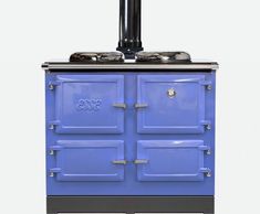 esse 990 series wood stove in light blue colour with black flue system.