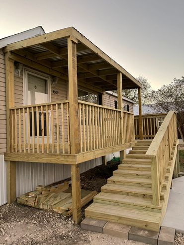A house with wood railings and custom steps