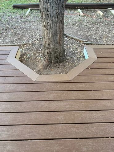 Custom Trex deck. Color is Saddle with Dune trim.