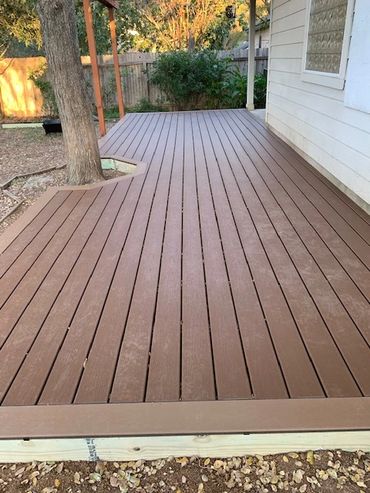 Custom Trex deck. Color is Saddle with Dune trim.