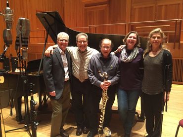Close-up of a guitarist and vocalist performing at a concert.

