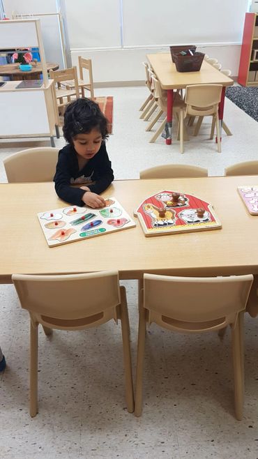 A busy Toddler engrossed in her work at Cornerstone Preschool Childcare! :)